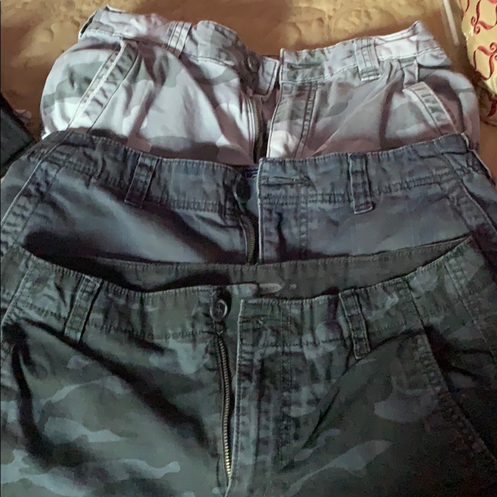 Three pair of cargo shorts.